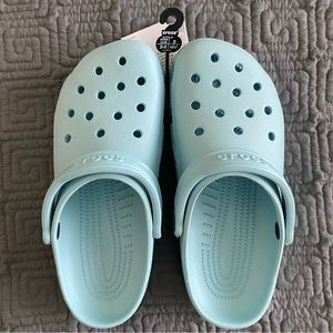 Light blue crocs, men’s size 7, women’s size 9.